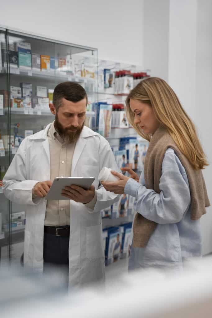 Pharmacist assisting customer with medication advice.